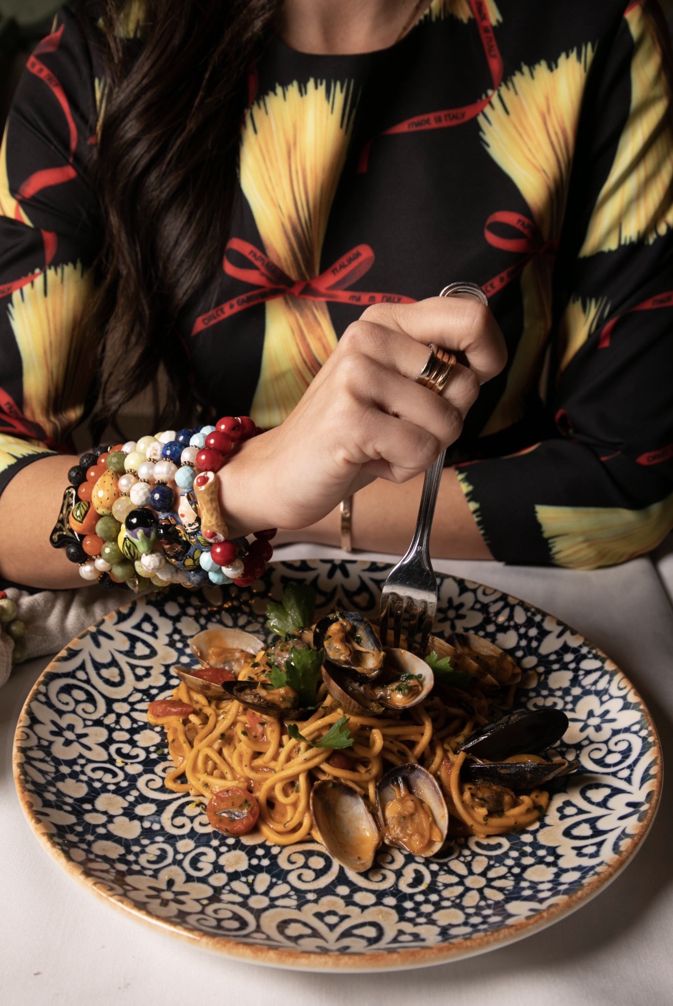 Pasta with clams on a hand-painted Sicilian plate
